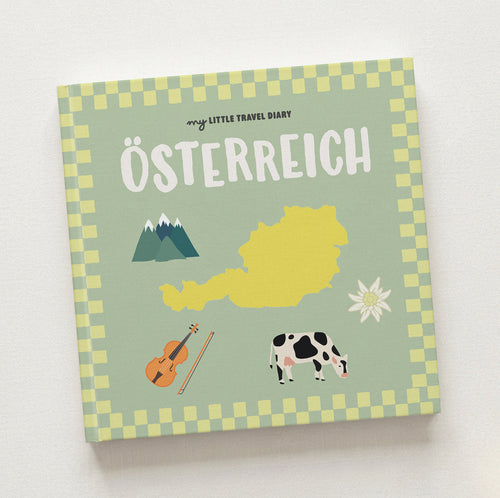 Österreich Reisetagebuch für Kinder – Cover mit Bergen, Geige, Kuh und Edelweiß
